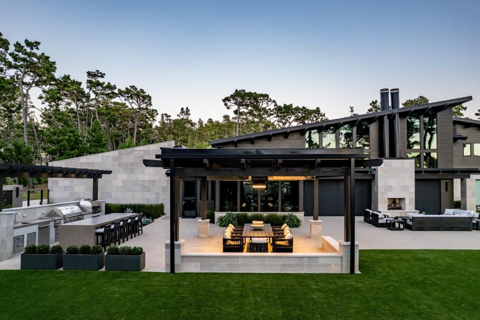 A striking backyard dining area by Sterling Huddleson Architecture.