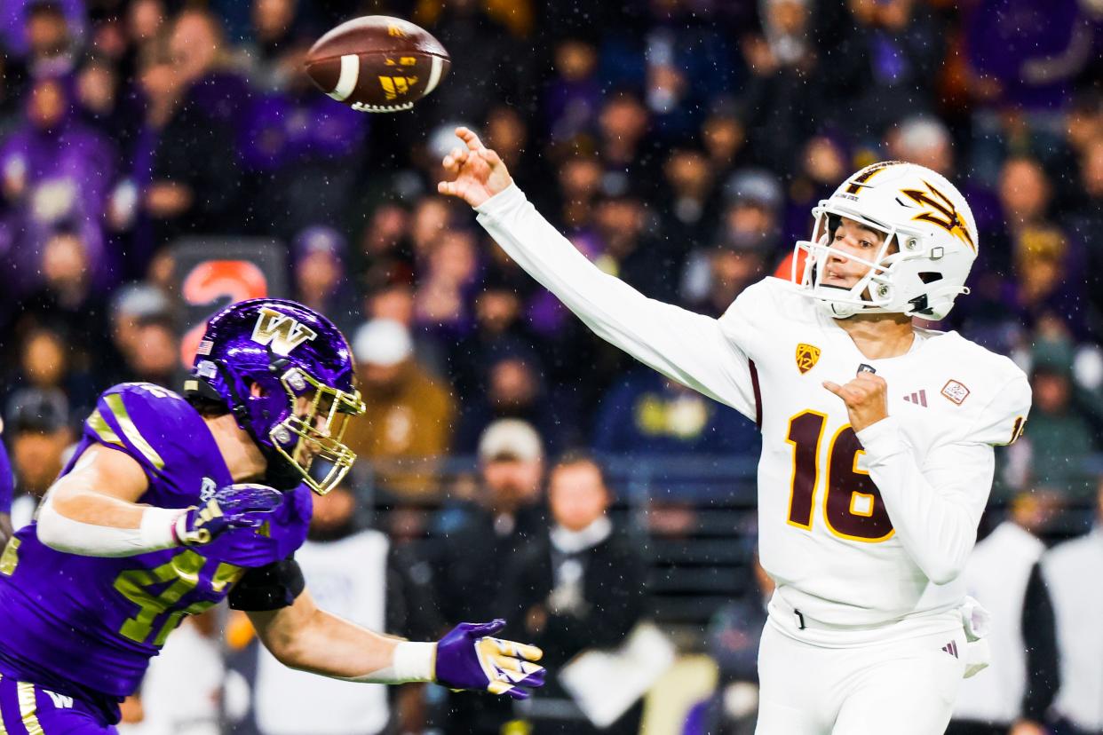 Oct 21, 2023; Seattle, Washington, USA; Arizona State Sun Devils quarterback Trenton Bourguet (16) passes against Washington Huskies linebacker Carson Bruener (42) during the first quarter at Alaska Airlines Field at Husky Stadium. Mandatory Credit: Joe Nicholson-USA TODAY Sports