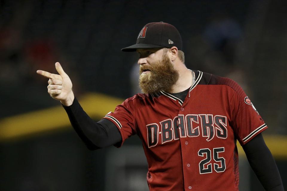 Arizona Diamondbacks relief pitcher Archie Bradley points to catcher Alex Avila after the final out of the ninth inning in a baseball game against the St. Louis Cardinals Wednesday, Sept. 25, 2019, in Phoenix. The Diamondbacks defeated the Cardinals 9-7. (AP Photo/Ross D. Franklin)