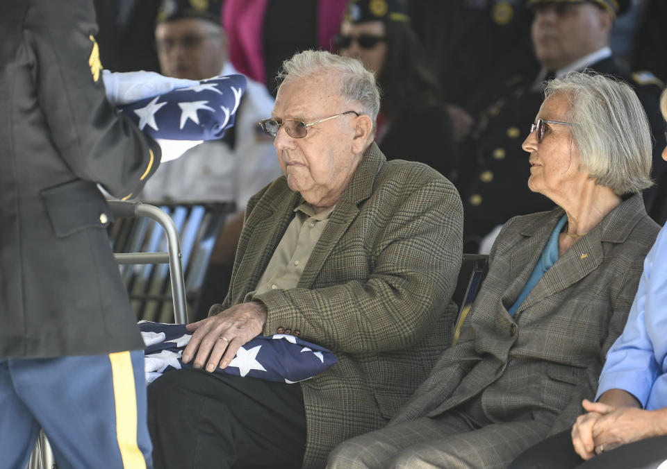 Douglas Smead ,left, and his sister Harriet Eggleston receive American flags as their brother Korean War veteran Army Cpl. Walter Smead, a member of Battery A, 57th Field Artillery Battalion, 7th Infantry Division who was killed during the 1950 Battle of the Chosin Reservoir, is laid to rest with full military honors at Gerald B. H. Solomon Saratoga National Cemetery, on Monday, Sept. 20, 2021, in Schuylerville, N.Y. Korean War veteran Army Cpl. Walter Smead, a member of Battery A, 57th Field Artillery Battalion, 7th Infantry Division who was killed during the 1950 Battle of the Chosin Reservoir, is laid to rest with full military honors at Gerald B. H. Solomon Saratoga National Cemetery, on Monday, Sept. 20, 2021, in Schuylerville, N.Y. Smead was finally laid to rest near his rural upstate New York hometown, seven decades after he was killed in the Korean War and months after his remains were finally identified with help from DNA analysis. (AP Photo/Hans Pennink)