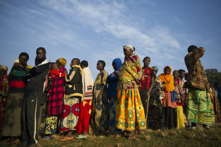 Residents line up prior to casting their vote in the village of Buye, the hometown of Burundi's president in Ngozi province, northern Burundi, on July 21, 2015