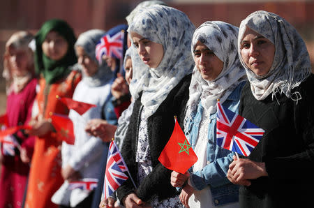 Residents wait for the arrival of Britain's Prince Harry and Meghan, Duchess of Sussex for a visit at a boarding house for girls run by the Moroccan NGO "Education for All" in Asni, Morocco, February 24, 2019. REUTERS/Hannah McKay