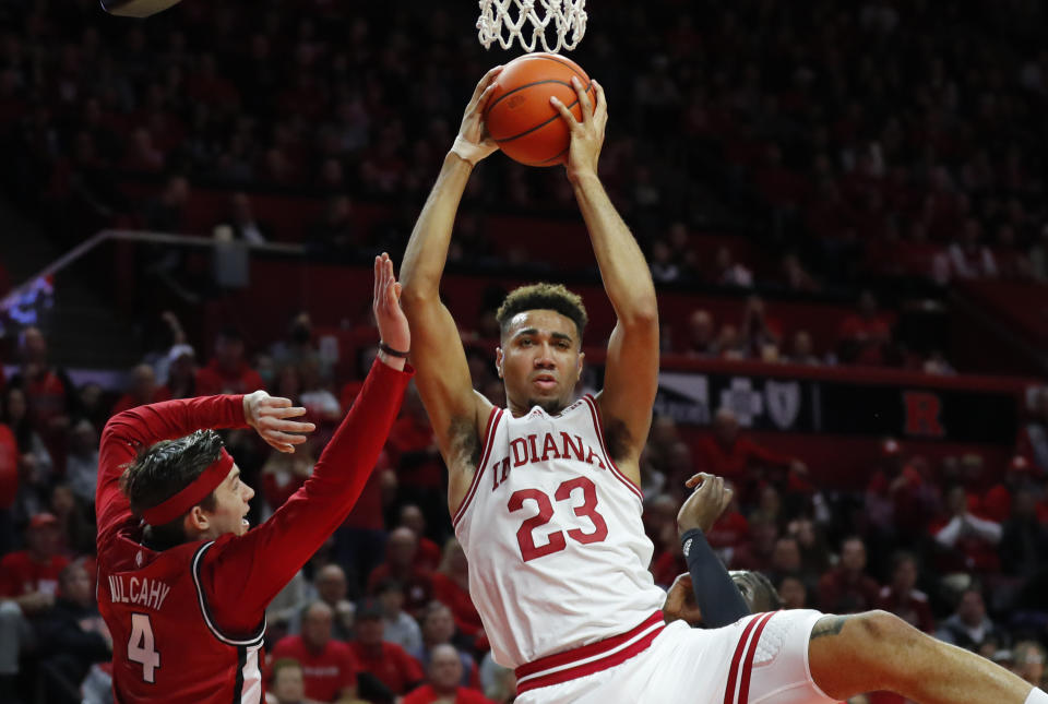 Indiana forward Trayce Jackson-Davis (23) is fouled by Rutgers guard Paul Mulcahy (4) during the first half of an NCAA college basketball game in Piscataway, N.J., Saturday, Dec. 3, 2022. (AP Photo/Noah K. Murray)