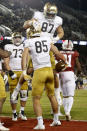 Notre Dame's George Takacs (85) celebrates with Michael Mayer (87) after catching a touchdown pass against Stanford during the first half of an NCAA college football game in Stanford, Calif., Saturday, Nov. 27, 2021. (AP Photo/Jed Jacobsohn)