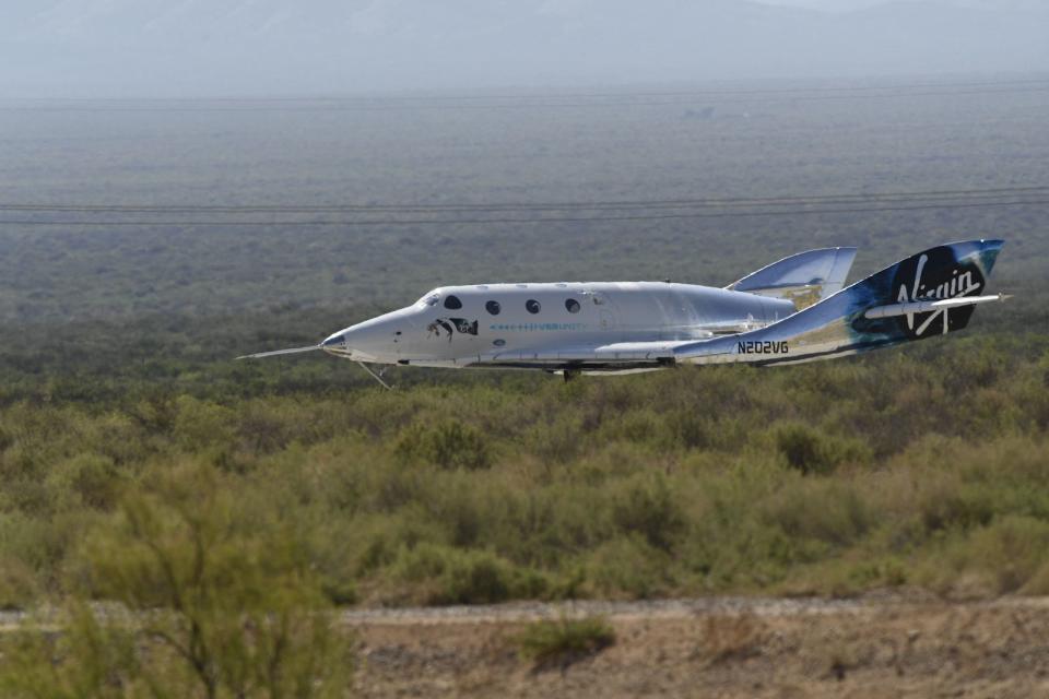 The Virgin Galactic SpaceShipTwo space plane Unity returns to earth after the mothership separated, at Spaceport America, near Truth and Consequences, New Mexico on July 11, 2021. - Billionaire Richard Branson took off July 11, 2021 from a base in New Mexico aboard a Virgin Galactic vessel bound for the edge of space, a voyage he hopes will lift the nascent space tourism industry off the ground.A massive carrier plane made a horizontal take-off from Spaceport, New Mexico at around 8:40 am Mountain Time (1440 GMT) and will ascend for around an hour to an altitude of 50,000 feet (15 kilometers).The mothership will then drop a rocket-powered spaceplane called VSS Unity, which will ignite its engine and ascend at Mach 3 beyond 50 miles (80 kilometers) of altitude, which marks the boundary of space according to the United States. (Photo by Patrick T. FALLON / AFP) (Photo by PATRICK T. FALLON/AFP via Getty Images)