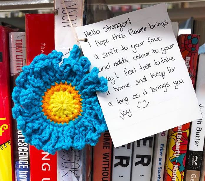 The flowers were left alongside notes, hoping to brighten a stranger's day. Source: Brisbane Libraries