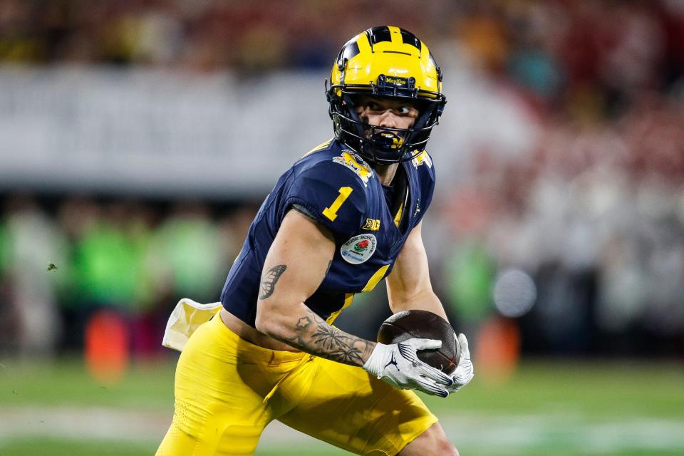 Michigan's Roman Wilson runs after a catch against Alabama during the Rose Bowl, Jan. 1, 2024.