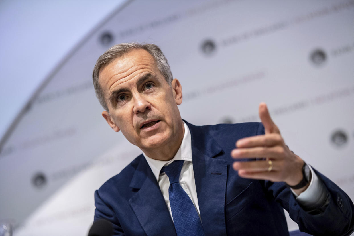 Governor of the Bank of England, Mark Carney speaks during the Bank of England interest rate decision and inflation report press conference at the Bank of England in London,  Thursday, Aug. 1, 2019. Brexit uncertainties are becoming "more entrenched" and increasingly weighing on the British economy less than three months before the country is scheduled to leave the European Union, the Bank of England said Thursday.(Chris J Ratcliffe/Pool Photo via AP)