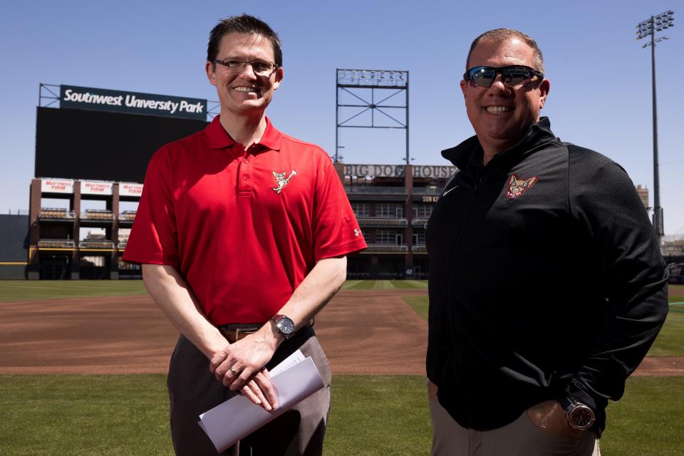 El Paso Chihuahuas broadcaster Tim Hagerty and Brad Taylor, General Manager of the Chihuahuas, pose for a photos at the dugout at the Southwest University Park on Wednesday, March 29, 2023.
