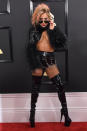 <p>In true Gaga fashion, the singer wore one of the most out-there looks on the red carpet — and she totally rocked it. She combined leather short-shorts with fishnets, thigh-high leather boots and an insane midriff-baring crop top that showed a lot of underboob. Body shamers, to the left. The outfit was the ultimate response to any Internet bullies who had a problem with her “belly rolls” as she performed at the Super Bowl halftime show. </p>