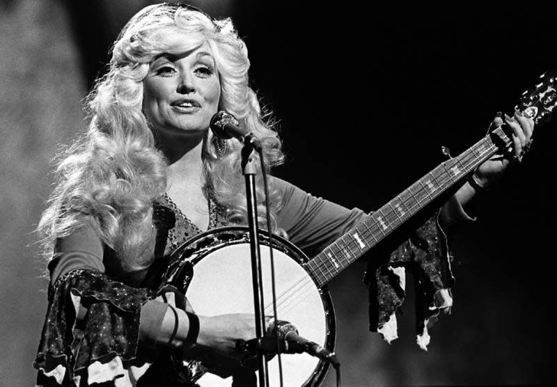 Dolly Parton performs during the 1976 CMA Awards show at the Grand Ole Opry House.