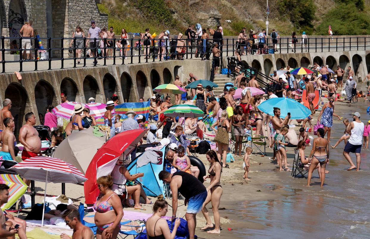 People enjoy the beach in Folkestone, Kent, during the hot weather.Picture date: Monday July 18, 2022. (Photo by Gareth Fuller/PA Images via Getty Images)