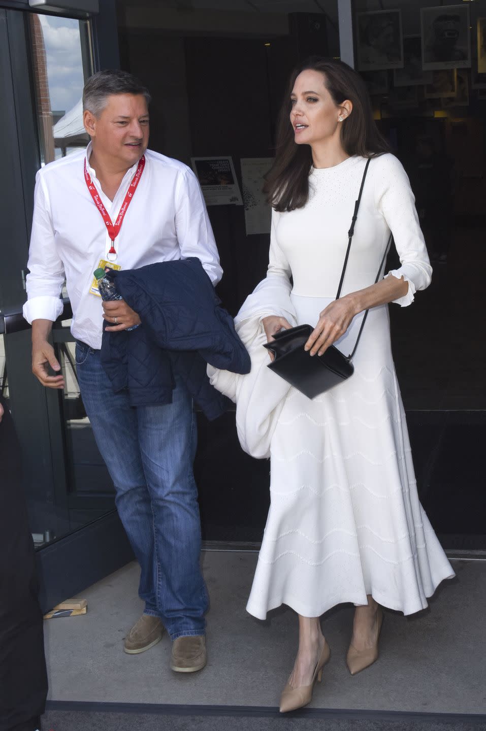 <p> Chief Content Officer for Netflix Ted Sarandos<span class="redactor-invisible-space"> walks with Angelina as they walk to the premiere of 'First They Killed My Father' at the Telluride film festival in Colorado.</span></p>