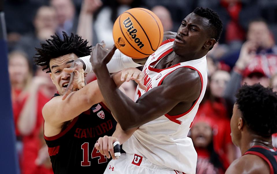 Stanford Cardinal forward Spencer Jones (14) and Utah Utes center Keba Keita (13) battle for a rebound as Utah and Stanford play in Pac-12 Tournament action at T-Mobile Arena in Las Vegas on Wednesday, March 8, 2023. Stanford won 73-62. | Scott G Winterton, Deseret News