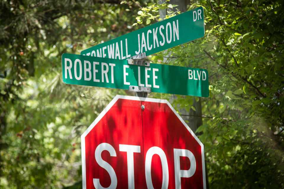 Signs at an intersection in Stone Mountain Park, honoring Confederate leaders, is seen on Monday, April 26, 2021, in Stone Mountain, Ga. The Stone Mountain Memorial Association, which oversees the massive park's design, is considering changes to the park's deeply contentious features honoring the Confederacy. (AP Photo/Ron Harris)
