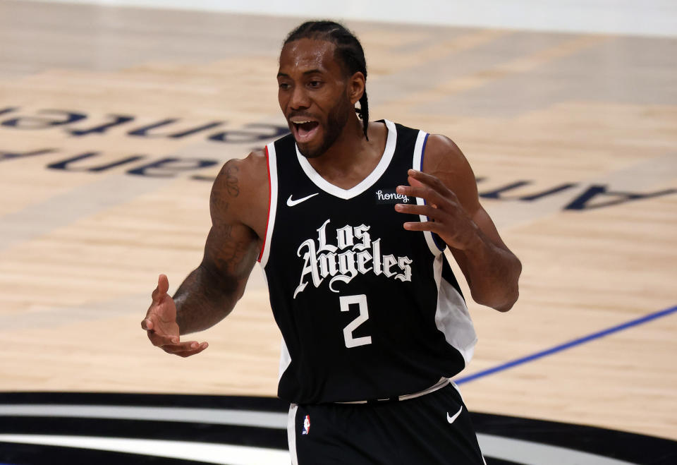 DALLAS, TEXAS - MAY 30:   Kawhi Leonard #2 of the LA Clippers reacts against the Dallas Mavericks in the third quarter in Game Four of the Western Conference first round series at American Airlines Center on May 30, 2021 in Dallas, Texas.  NOTE TO USER: User expressly acknowledges and agrees that, by downloading and or using this photograph, User is consenting to the terms and conditions of the Getty Images License Agreement. (Photo by Ronald Martinez/Getty Images)