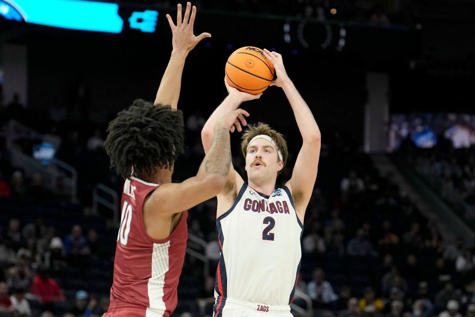 Gonzaga forward Drew Timme (2) shoots against Arkansas forward Jaylin Williams during the first half of a college basketball game in the Sweet 16 round of the NCAA tournament in San Francisco, Thursday, March 24, 2022. (AP Photo/Tony Avelar)