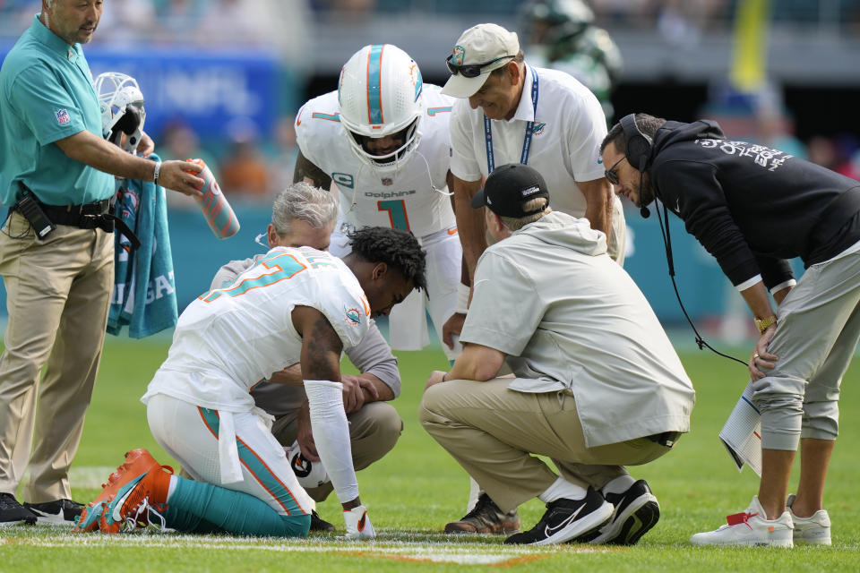 Miami Dolphins wide receiver Jaylen Waddle (17) is attended on the field during the first half of an NFL football game against the New York Jets, Sunday, Dec. 17, 2023, in Miami Gardens, Fla. (AP Photo/Lynne Sladky)