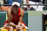 Mar 30, 2017; Miami, FL, USA; Caroline Wozniacki of Denmark smiles while sitting in her player's chair after her match against Karoilina Pliskova of the Czech Republic (not pictured) in a women's singles semi-final during the 2017 Miami Open at Crandon Park Tennis Center. Wozniacki won 5-7, 6-1, 6-1. Geoff Burke-USA TODAY Sports