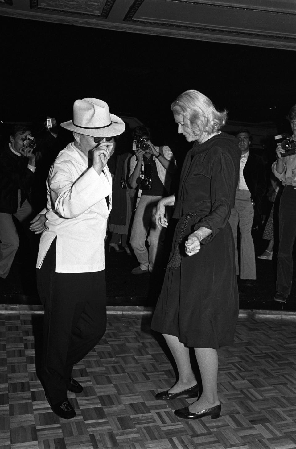 Truman Capote dances with C. Z. Guest 