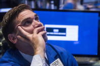 A trader waits for news while working on the floor of the New York Stock Exchange in New York, July 8, 2015. REUTERS/Lucas Jackson