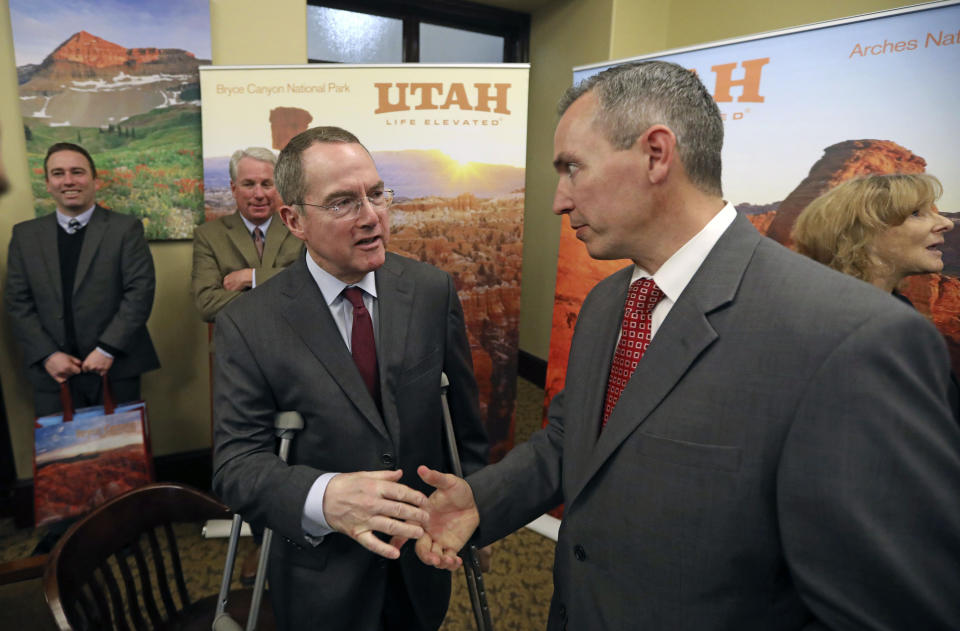 Sen. Dan McCay, R - Riverton, right, shakes hand with Bob Steiner, left, Co-CEO of Alsco Inc., following a news conference Thursday, Jan. 24, 2019, in Salt Lake City. Alsco, a Utah company is donating $100,000 to keep three national parks open as the federal government shutdown drags on, a gift that state officials say is unique in the country. Salt Lake City-based uniform and linen rental company Alsco said Thursday, Jan, 24, 2019, the money will fund operations at Zion, Bryce and Arches national parks. It will pay for basic custodial and visitor center services at least through Feb 18, as the parks' busy season begins.(AP Photo/Rick Bowmer)