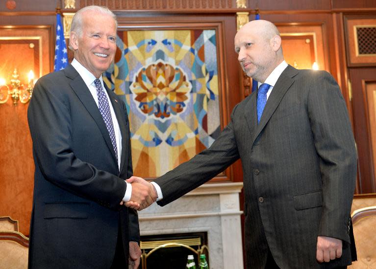 US Vice President Joe Biden (left) shakes hands with Ukraine's interim president Olexander Turchynov ahead of talks in Kiev, on April 22, 2014