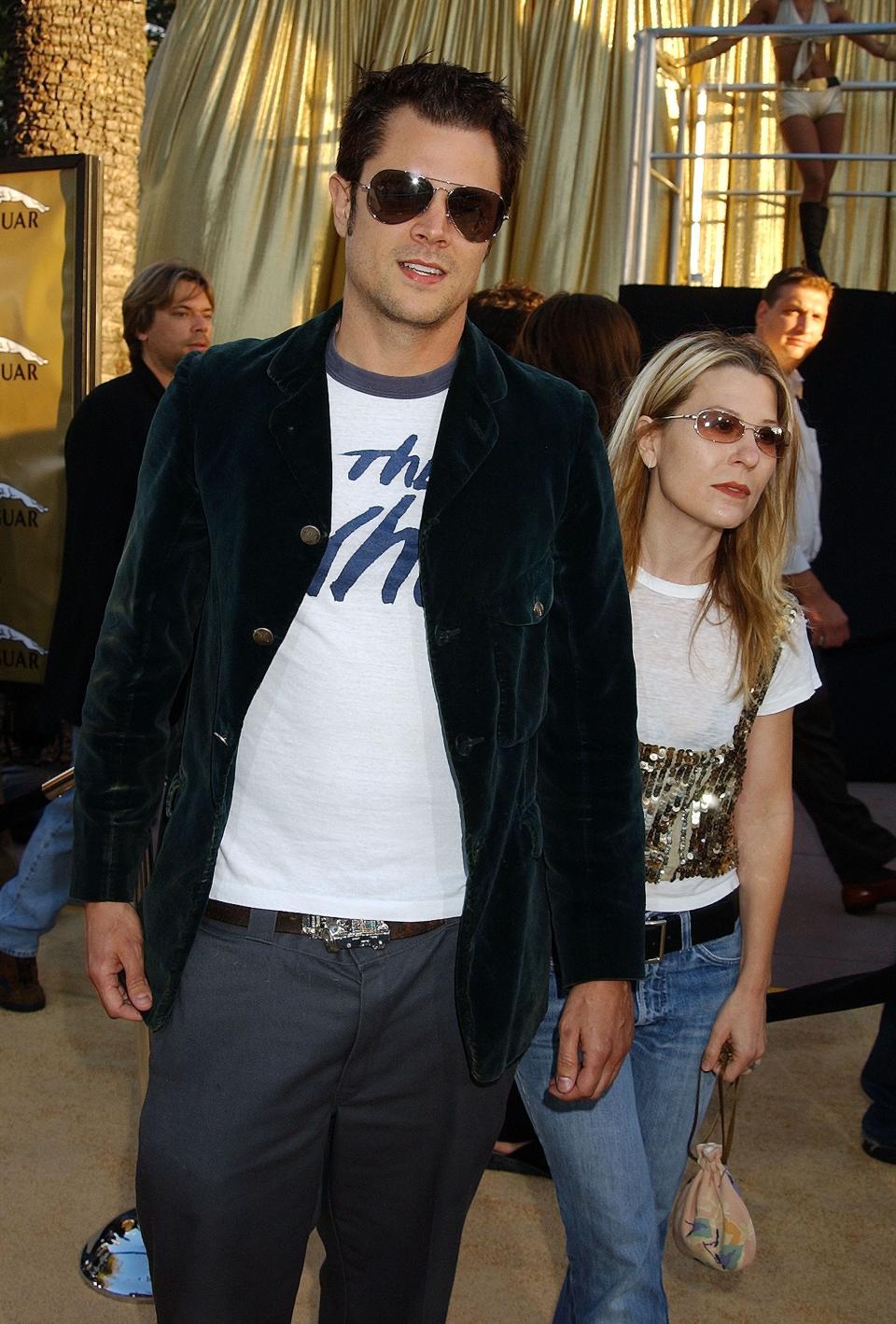 Johnny Knoxville in sunglasses an a dark jacket