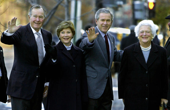 WASHINGTON, UNITED STATES:  Former US President George H.W. Bush (L) and his wife Barbara Bush(R) walk into St. John's Episcopal Church with their son US President George W. Bush(2nd-R) and his wife Laura to attend an early Sunday morning prayer service in 07 December 2003 in Washington. The historical church is a block away from the White House and has served various presidents for years.  AFP Photo/Paul J. RICHARDS  (Photo credit should read PAUL J.RICHARDS/AFP/Getty Images)