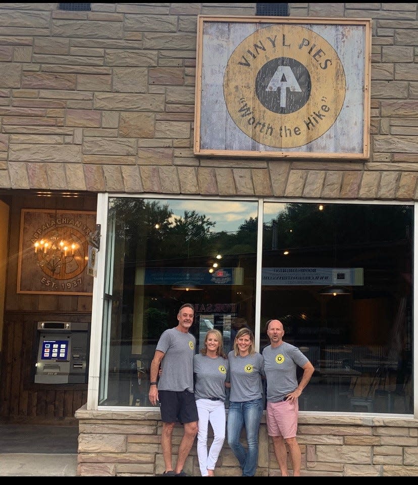 From right, Vinyl Pies Pizza owners Gary and Karen Goss pose with their business partners Ashley Skipper and Marty Martin in front of the new Hot Springs pizzeria, which is set to open before the end of September.