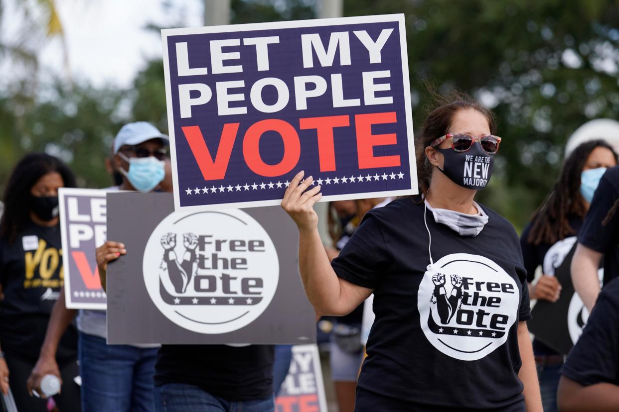 Supporters of restoring the voting rights of former felons march to an early voting precinct in Fort Lauderdale. The Florida Rights Restoration Coalition led marches to the polls in dozens of Florida counties.