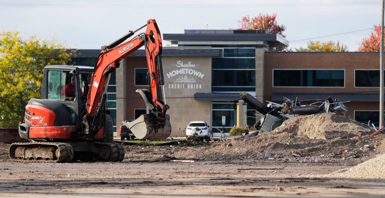 Demolition crews work on clearing where the Manitowoc Visitor Center was as seen, Thursday, September 28, 2023, in Manitowoc, Wis. 