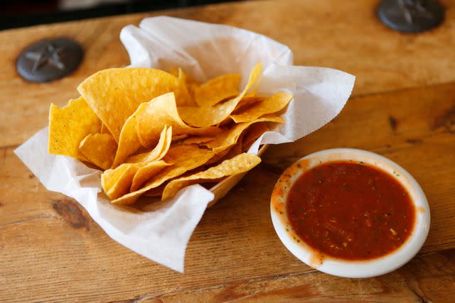 <p>Getty</p> Tortilla chips and salsa