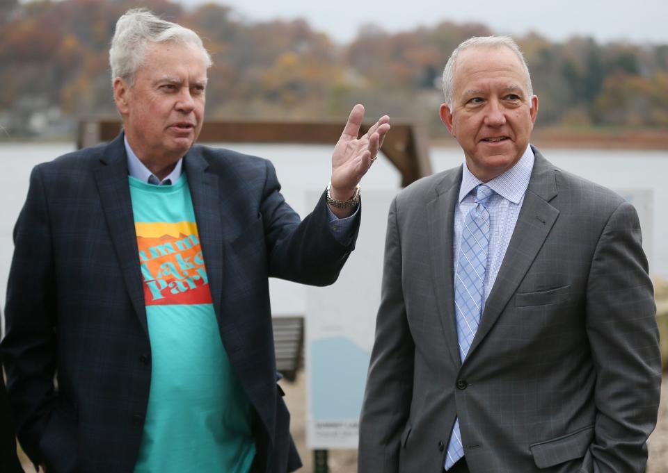 Bill Considine, left, retired CEO of Akron Children's Hospital, talks with Mayor Dan Horrigan. Considine and his wife, Rebecca, have campaigned to raise $2.5 million in private donations for the Summit Lake project.