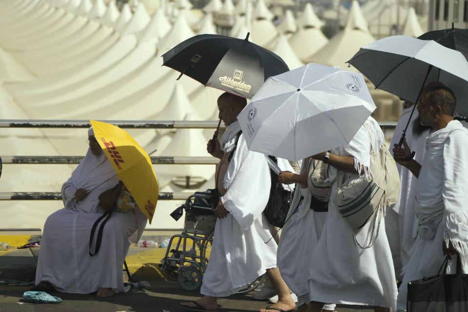 Pilgrims walk at Mina tent camp during the annual Hajj pilgrimage, near the holy city of Mecca, Saudi Arabia, Wednesday, June 28, 2023. Around two million pilgrims are converging on Saudi Arabia's holy city of Mecca for the largest Hajj since the coronavirus pandemic severely curtailed access to one of Islam's five pillars. (AP Photo/Amr Nabil)
