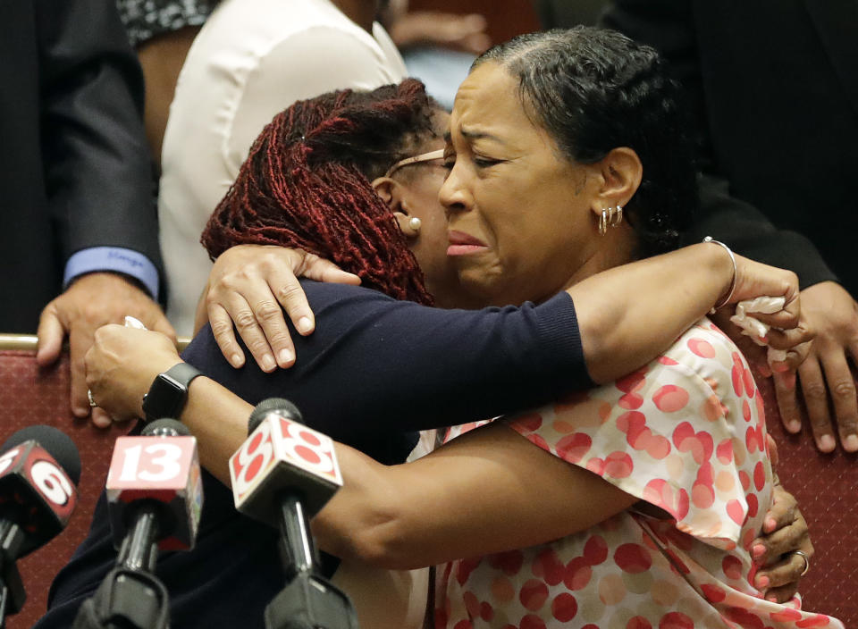 Lisa Berry, right, is comforted by Kyrie Rose following a news conference regarding the July 19 duck boat accident, Tuesday, July 31, 2018, in Indianapolis. A second lawsuit has been filed by members of an Indiana family who lost nine relatives when a tourist boat sank this month in Missouri. The federal lawsuit was filed Tuesday in Missouri on behalf of the estates of two members of the Coleman family. They were among 17 people killed in the July 19 sinking near Branson. (AP Photo/Darron Cummings)