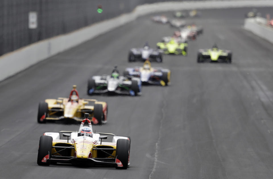 Takuma Sato, of Japan, leads a group of cars into turn one during practice for the Indianapolis 500 IndyCar auto race at Indianapolis Motor Speedway, Monday, May 20, 2019, in Indianapolis. (AP Photo/Darron Cummings)