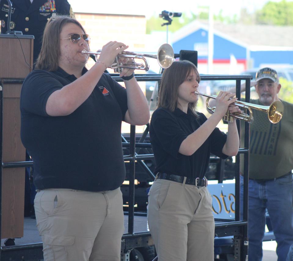 Cheboygan High School band members play taps in honor of those fallen during Monday's Memorial Day event in Festival Square.