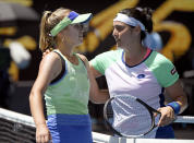 Sofia Kenin, left, of the U.S. is congratulated by Tunisia's Ons Jabeur after winning their quarterfinal match at the Australian Open tennis championship in Melbourne, Australia, Tuesday, Jan. 28, 2020. (AP Photo/Andy Brownbill)