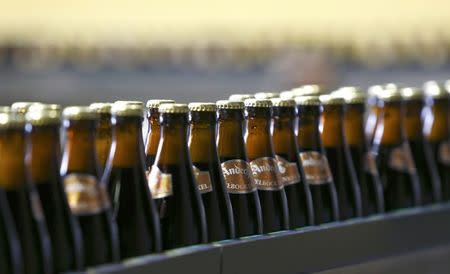 Bottles of beer are transported on a belt at 'Kloster Andechs' brewery in Andechs near Munich, Germany, April 19, 2016. REUTERS/Michaela Rehle