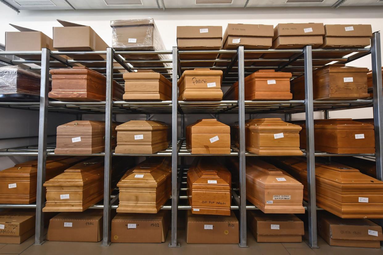 Coffins are placed on scaffolding in the Crematorium Temple of Piacenza, northern Italy, awaiting cremation due to the coronavirus emergency on March 23, 2020