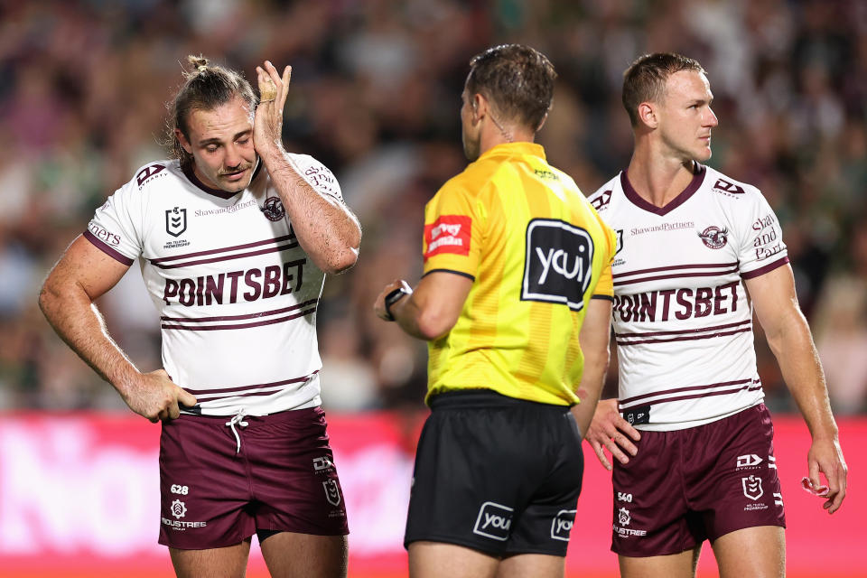 Karl Lawton (pictured left) looks disappointed as he is sent off after a dangerous tackle.