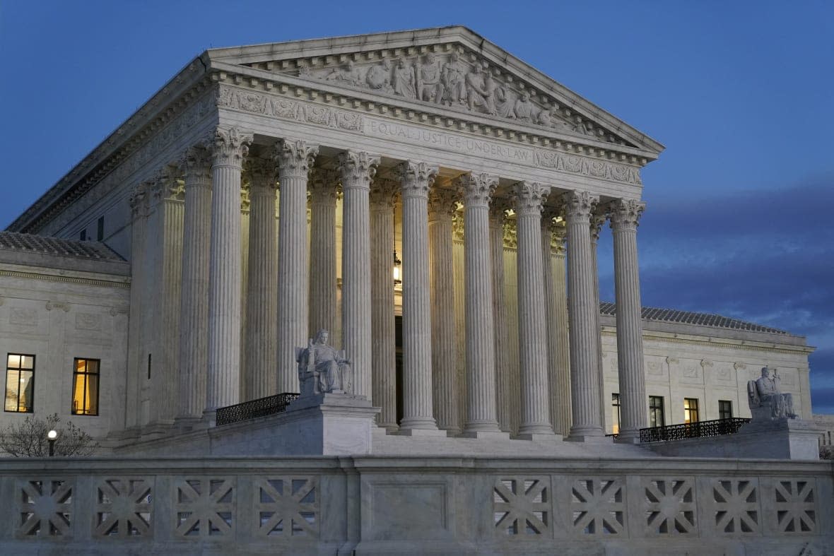 Light illuminates part of the Supreme Court building at dusk on Capitol Hill in Washington on Nov. 16, 2022. (AP Photo/Patrick Semansky, File)