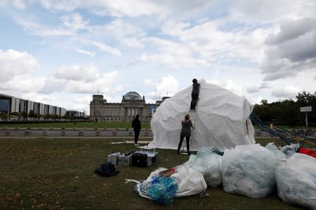 Climate activists set up a camp in Berlin one day before thousands are expected to gather at Berlin's Brandenburg Gate