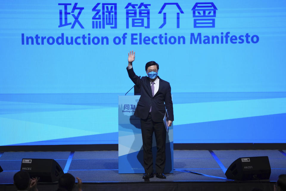 John Lee, former No. 2 official in Hong Kong, and the only candidate for the city's top job, announces his manifesto during the 2022 chief executive electoral campaign in Hong Kong, Friday, April 29, 2022. Lee formally registered his candidacy for chief executive earlier this month after securing 786 nominations to enter the race. (AP Photo/Kin Cheung)