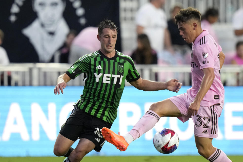 Inter Miami defender Noah Allen (32) runs with the ball as Austin FC midfielder Ethan Finlay, left, defends during the first half of an MLS soccer match, Saturday, July 1, 2023, in Fort Lauderdale, Fla. (AP Photo/Lynne Sladky)
