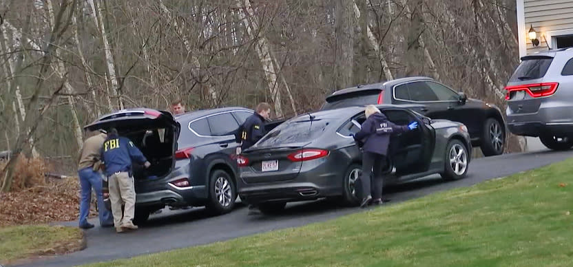 FBI personnel at the home of Lynn Clark, the superintendent of Chicopee Schools, in Massachusetts. (WWLP)