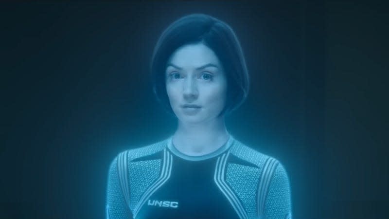 A woman appears in a hologram.