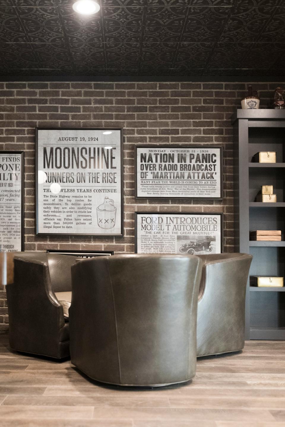 Posters depicting 1920&#39;s Prohibition headlines grace the walls of a Hudson, Ohio, basement speak-easy.