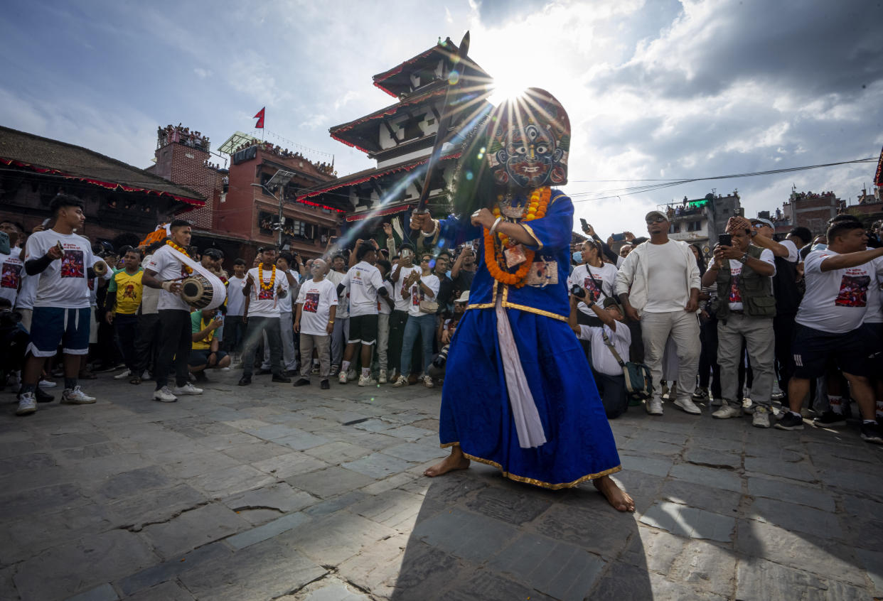 A masked dancer performs during Indra Jatra, a festival that marks the end of the rainy season in Kathmandu, Nepal, Tuesday, Sept. 17, 2024. (AP Photo/Niranjan Shrestha)